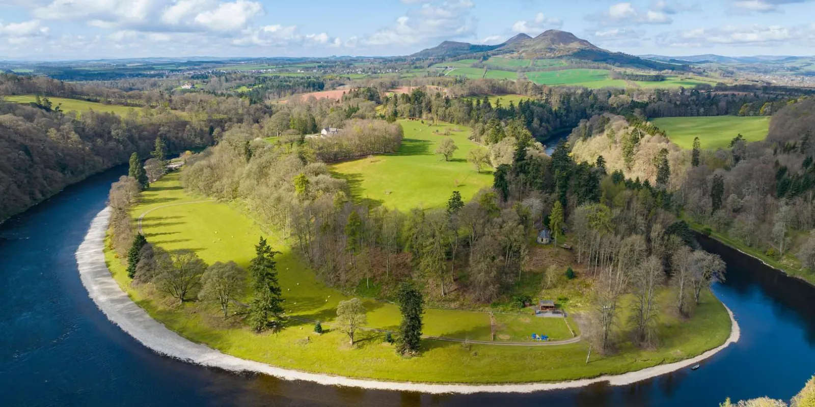 A wooded bend of the river in the Scottish Borders countryside