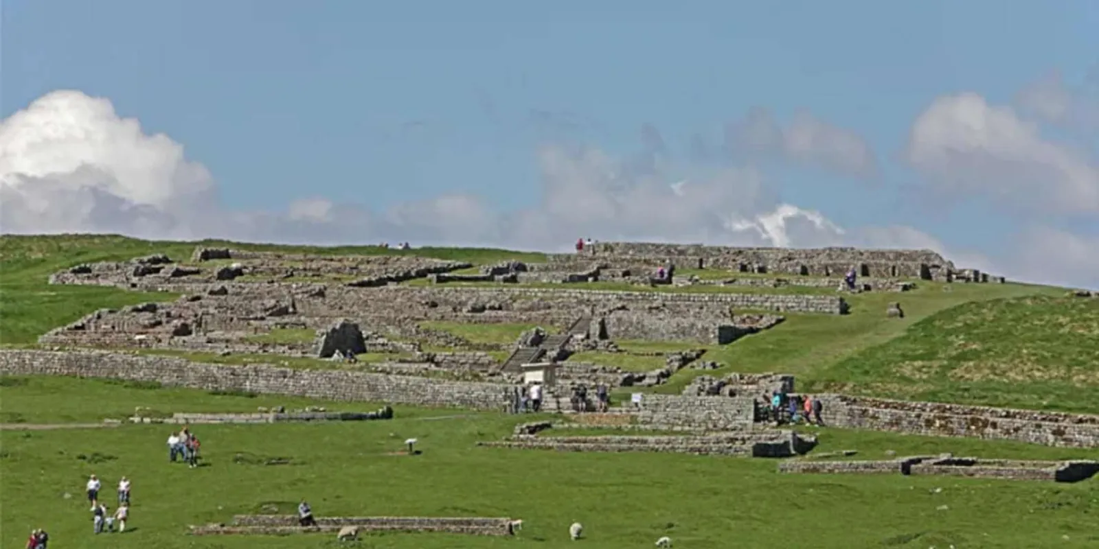 The excavated fort platform at Vindolanda seen across the Northumberland hills