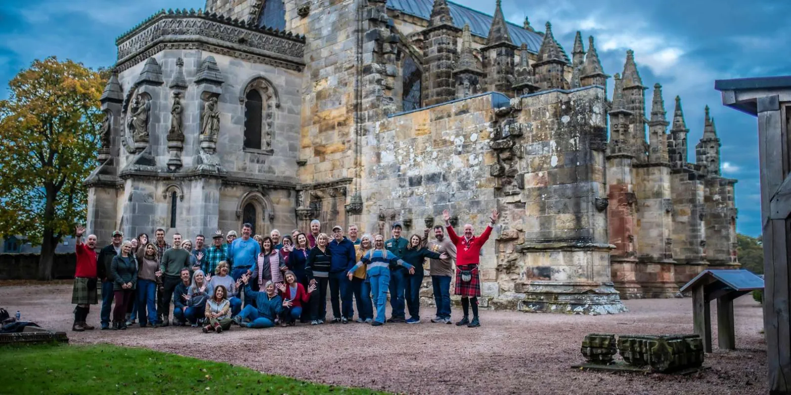 A small tour group gathered outside Rosslyn Chapel at the start of the visit